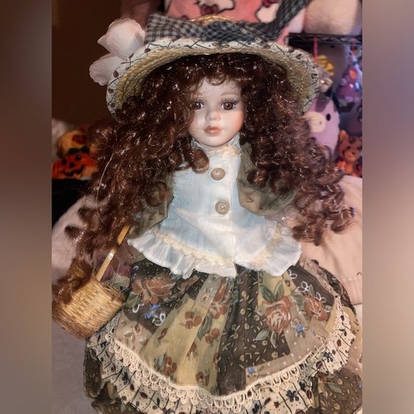 Porcelain doll with brown curly hair holding a basket lamp - Picture 1 of 5